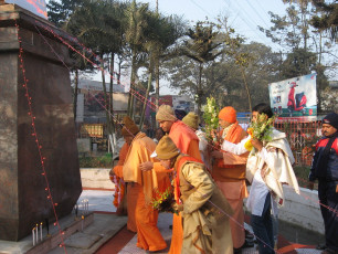 Rev. Swami Prabhanandaji Mj offering garland and flowers on the statue of Swami Vivekanananda at Sadarghat, Silchar=