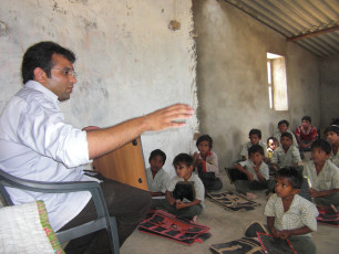 AN ASHRAMA VOLUNTEER WITH THE CHILDREN