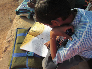 A CHILD READING SWAM VIVEKANANDA' S LIFE